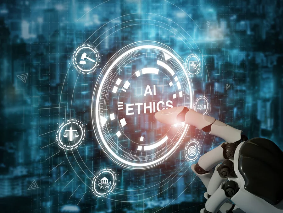 A robotic hand pointing at a digital interface with the words 'AI Ethics' displayed in the center. Surrounding the main text are icons representing law, justice, government, and ethical guidelines, symbolizing the principles of ethical artificial intelligence. The background is a futuristic, blurred cityscape with a digital overlay, emphasizing the intersection of technology and ethics.